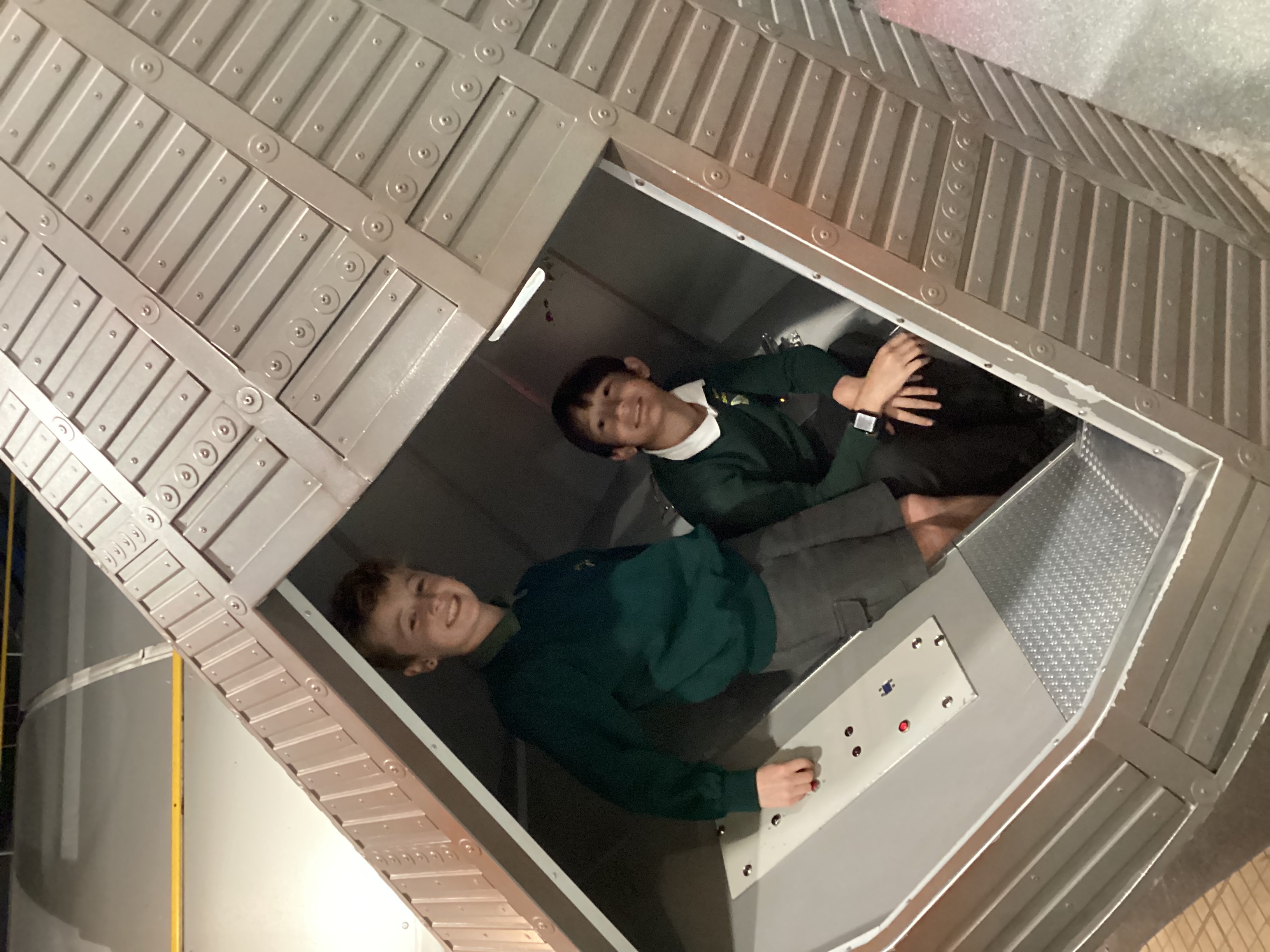Boys sitting in a space ship